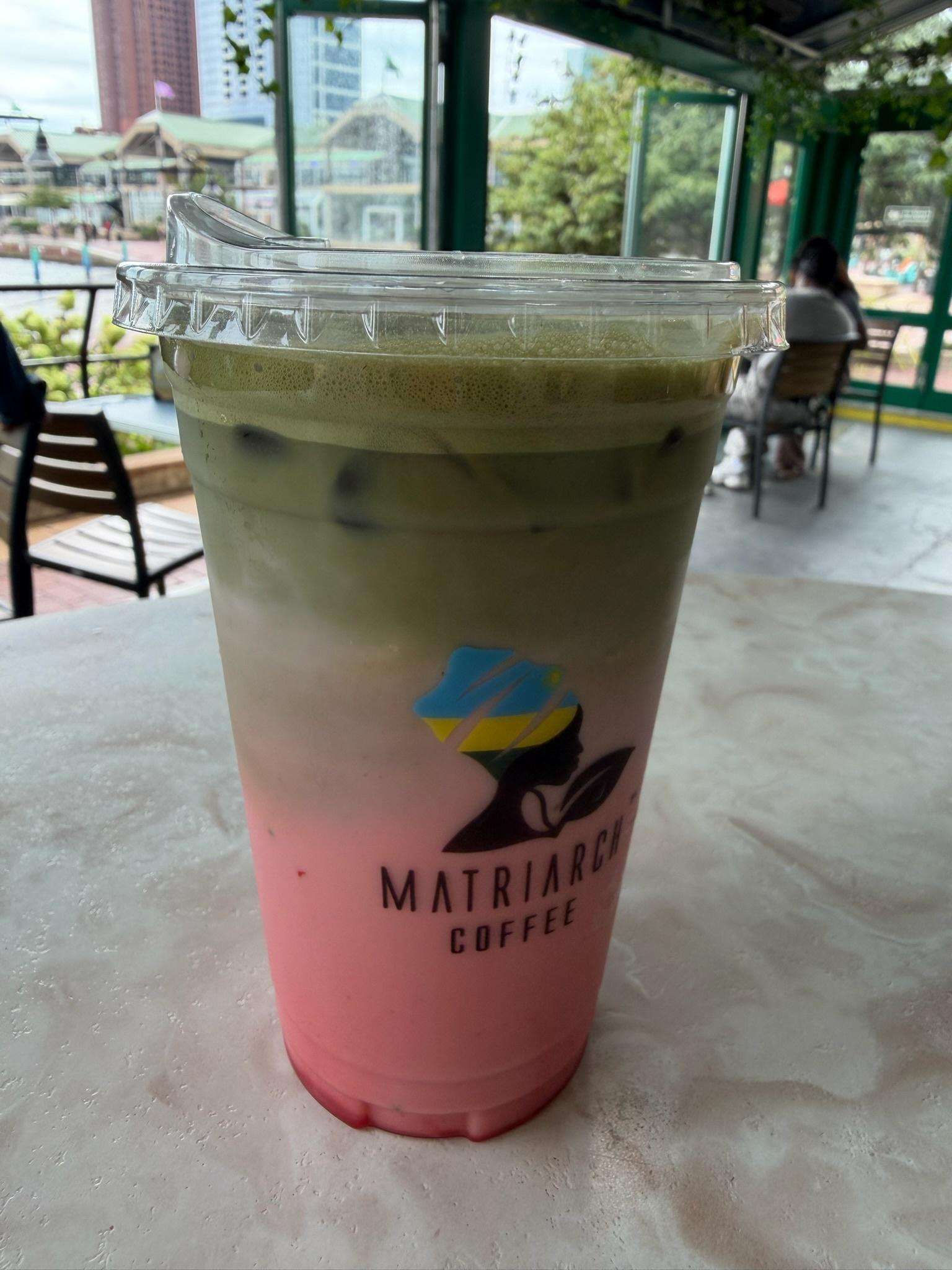Matriarch Coffee matcha drink with waterfront view